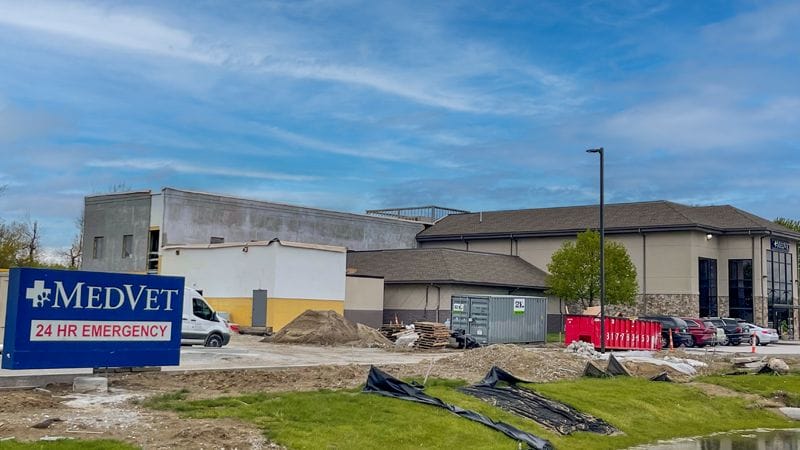 Veterinary hospital MedVet Indianapolis building showing MedVet blue sign and expansion construction to increase building size